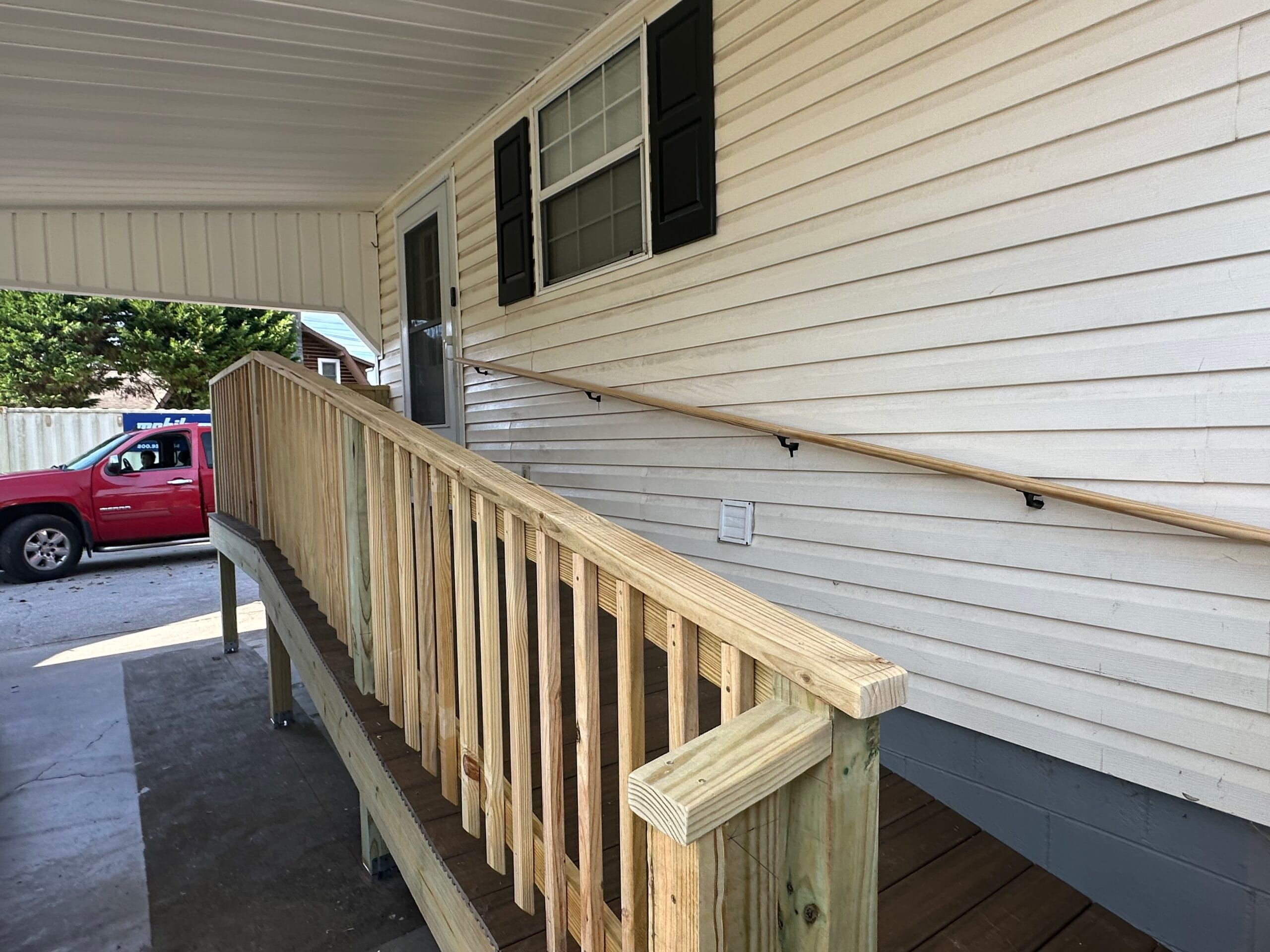 Completed pressure-treated deck with railings in Knoxville, TN