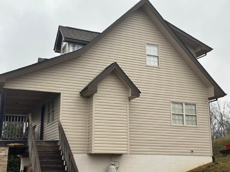 Mel Hernandez, owner of MI Homesiding & Roofing, providing a siding consultation in Knoxville.