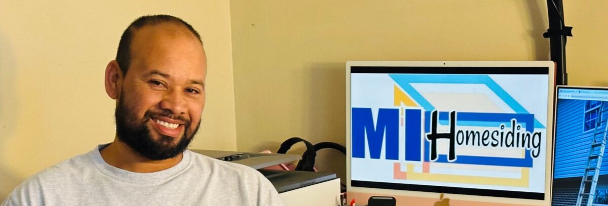 Mel Hernandez, owner of MI Homesiding & Roofing, at the company office