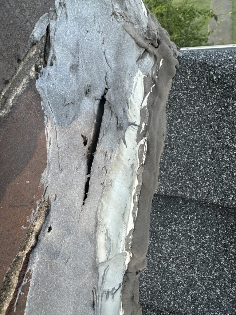 Brown water stain on ceiling caused by wind damage roof leak in Knoxville TN