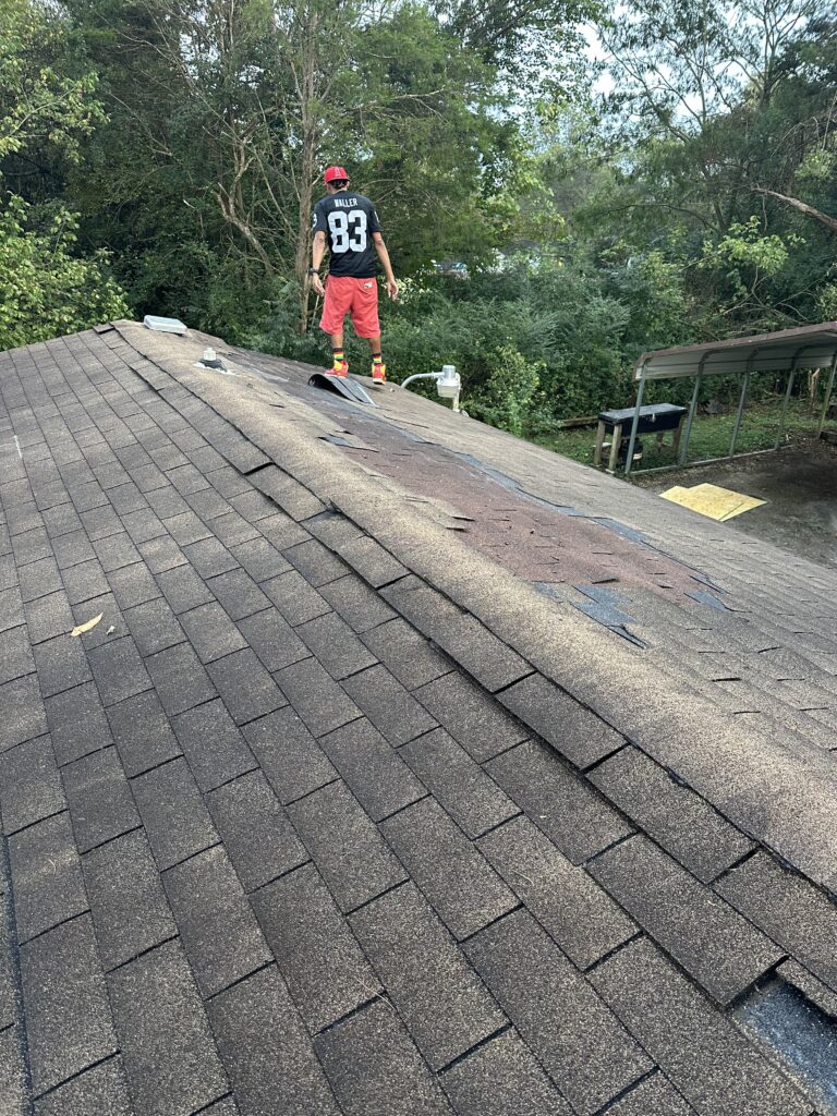 A professional MI Homesiding & Roofing roof inspection in Knoxville identifying common problems like leaks and wind damage.