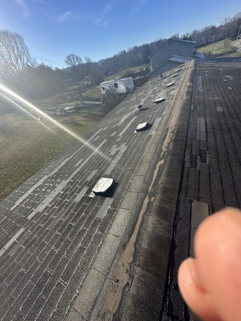 A smartphone screen displaying a professional roofing inspection report app in Knoxville.