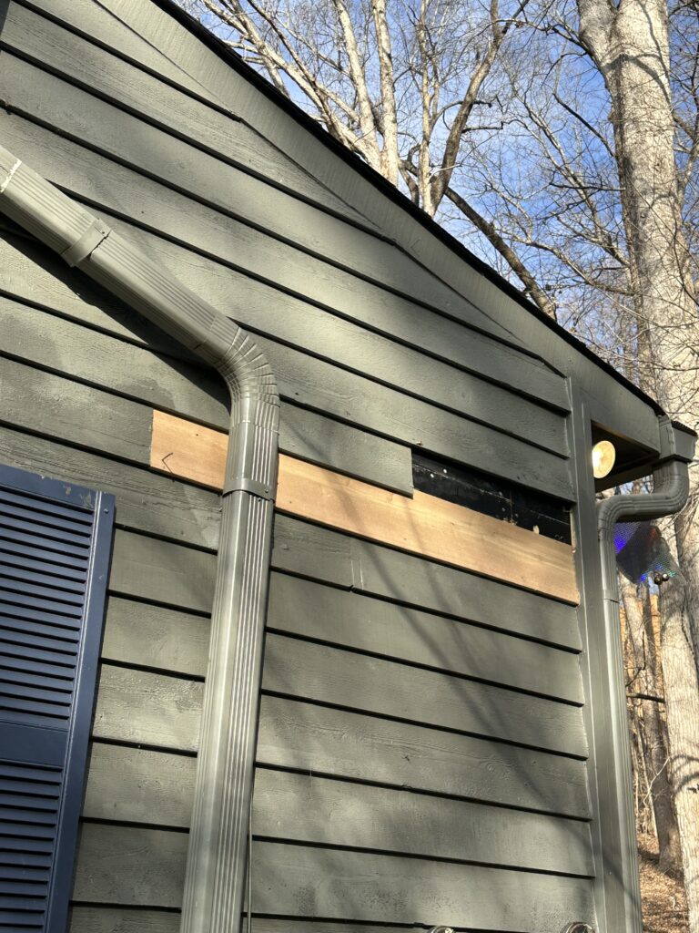 Emergency siding repair after storm damage in Knoxville TN with missing vinyl siding panels