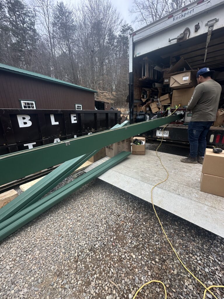 Exterior wood window trim showing signs of rot and peeling paint due to high humidity.
