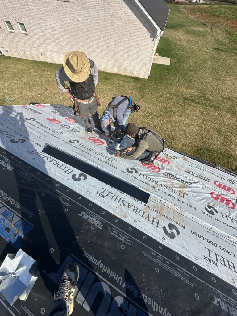 Close-up of a sun-damaged and cracked rubber roof vent boot causing a leak.