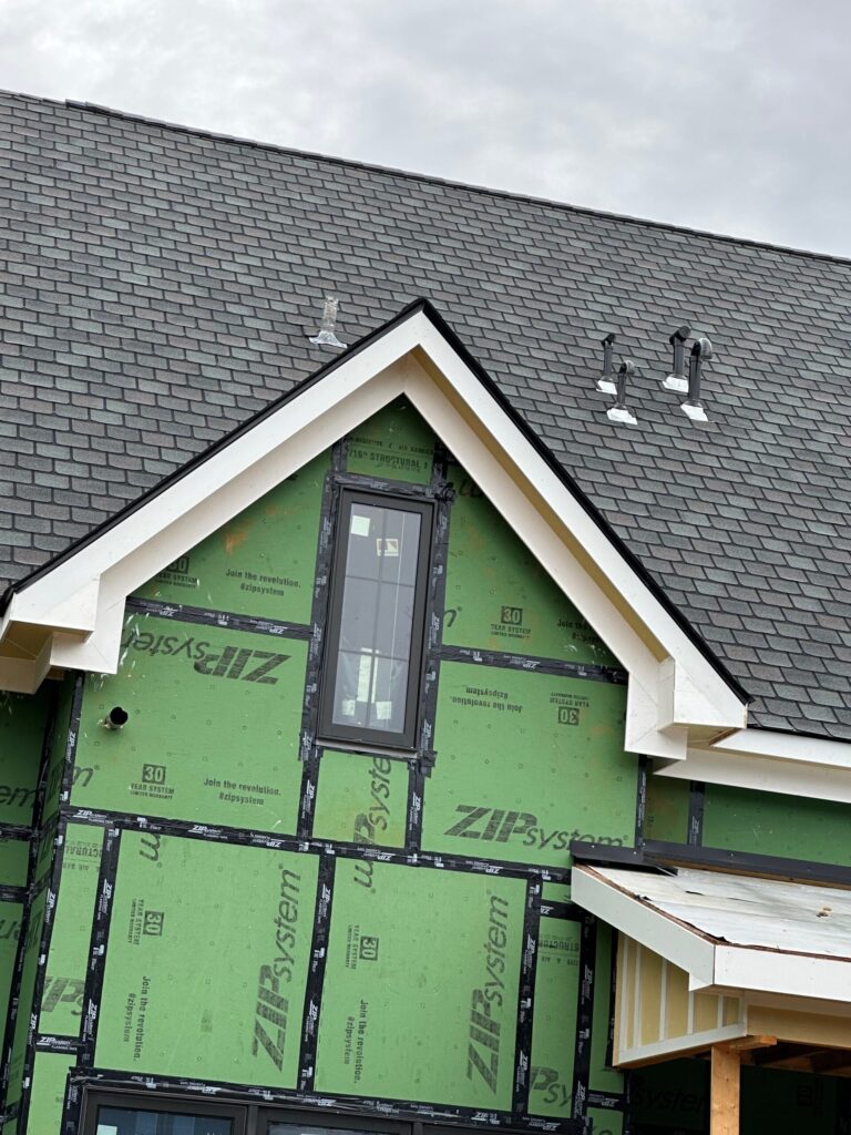 Gable end with ZIP System sheathing and newly installed white soffit and fascia in Knoxville, TN