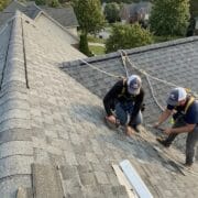 Dramatic side shot of a steep pitch residential roof requiring harnesses and safety ropes for a roof replacement project in Knoxville TN.