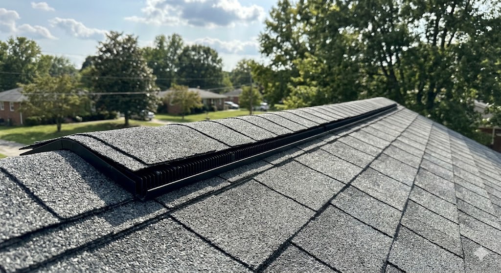 Close-up of a new, perfectly installed professional ridge vent system on an asphalt shingle roof in Knoxville, TN.