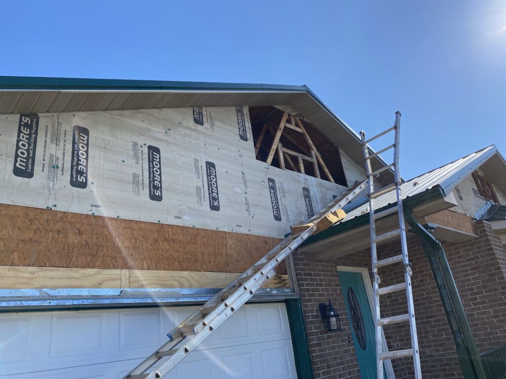 Identifying gaps between the window frame and siding that cause drafts.