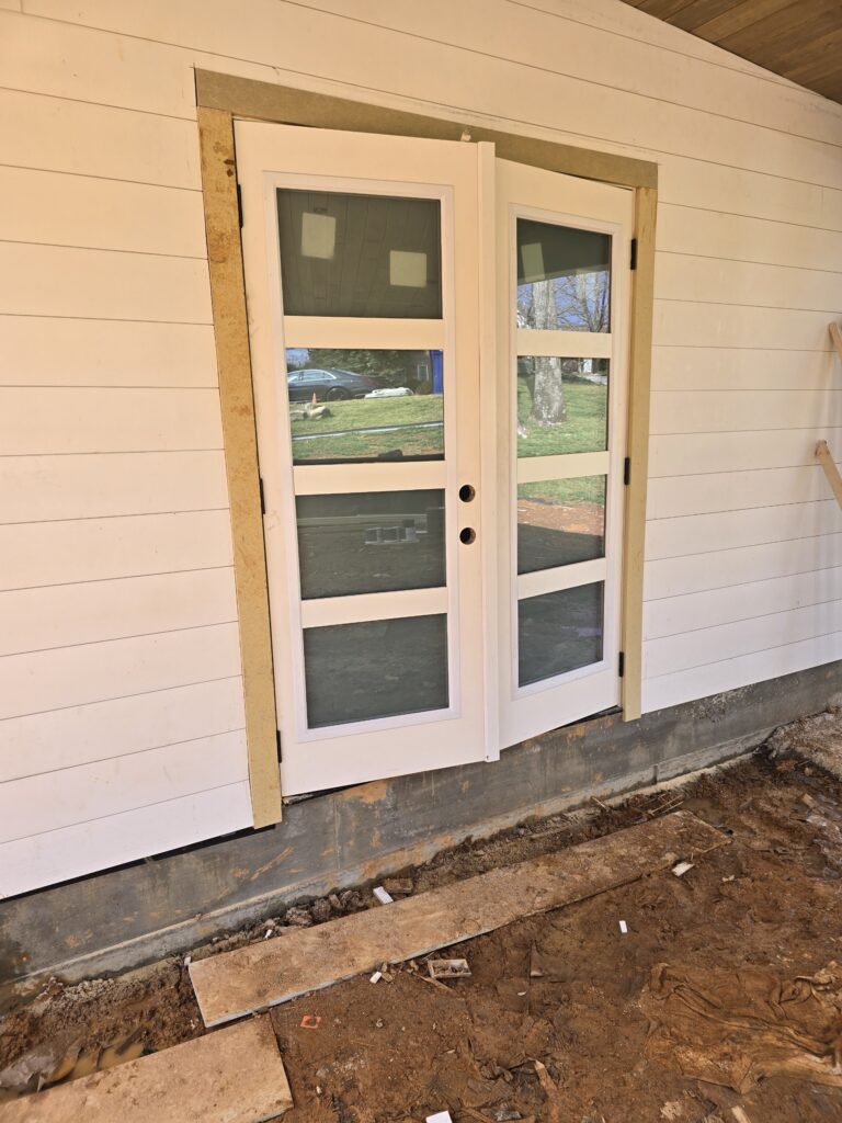 Replacing old, inefficient windows with new vinyl double hung units.