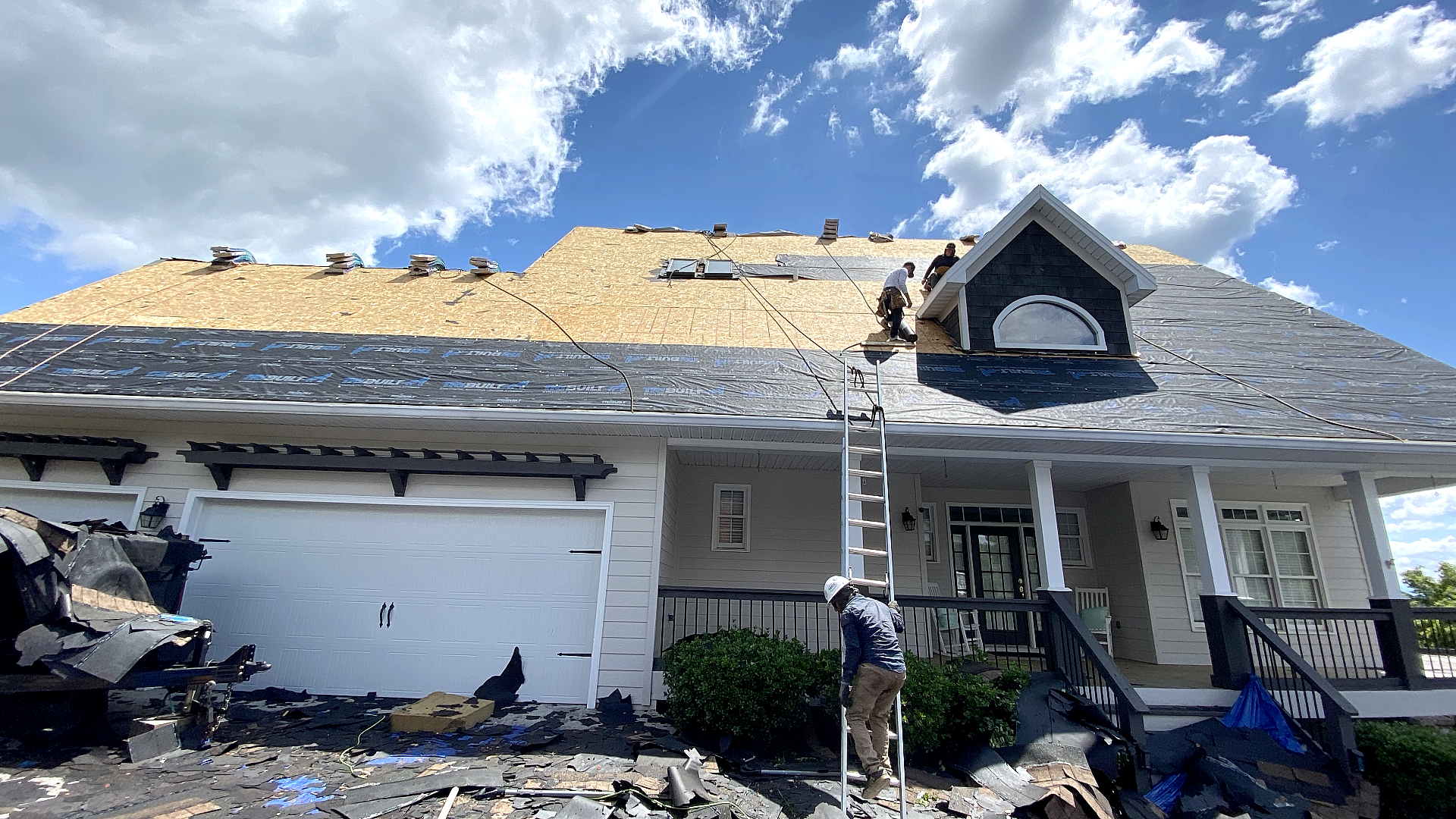 Mel Hernandez inspecting a roof replacement project in Knoxville TN