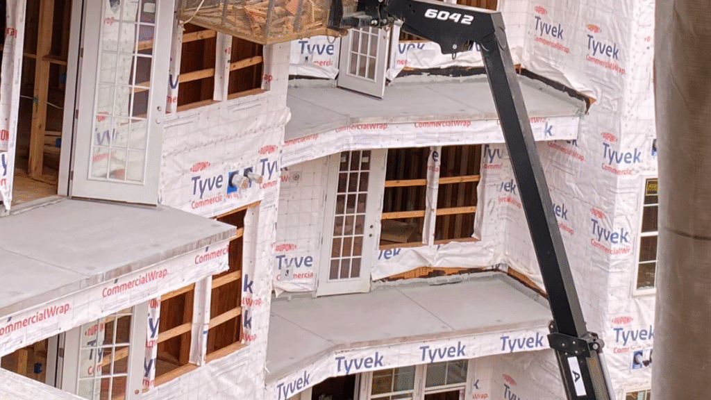 Mel Hernandez and the MI Homesiding & Roofing family-owned business team.