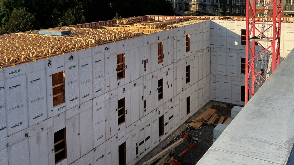 Identifying visible gaps between a window frame and siding that allow drafts.