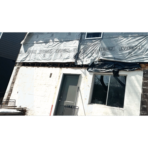 Checking a loose deck railing for safety compliance.