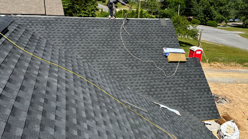 A professional MI Homesiding & Roofing roof inspection in Knoxville diagnosing complex roofing failures caused by local weather patterns.