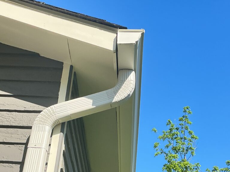 Professional contractor Mel Hernandez from MI Homesiding LLC performing a detailed gutter and fascia inspection on a Knoxville home to provide an accurate, surprise-free estimate.