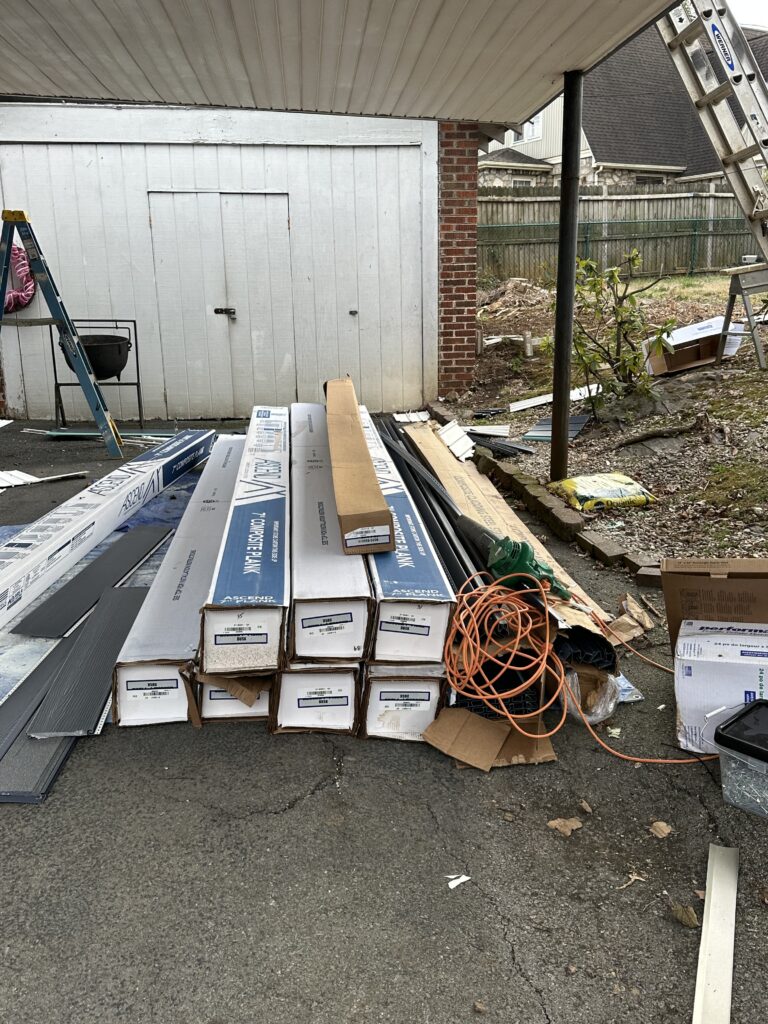 echnical inspection during a complete siding replacement project in Knoxville, showing how old damaged wood is repaired before new siding is installed by MI Homesiding LLC.