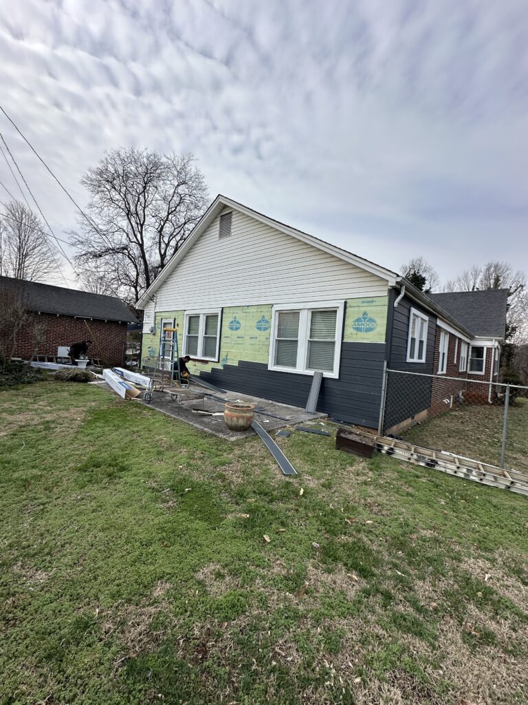 Comparison of premium vinyl and fiber cement siding materials for home replacement in East Tennessee.