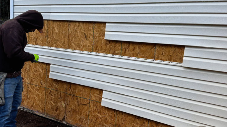 MI Homesiding LLC technician using a moisture meter during a Technical Assessment for a siding repair in Knoxville.