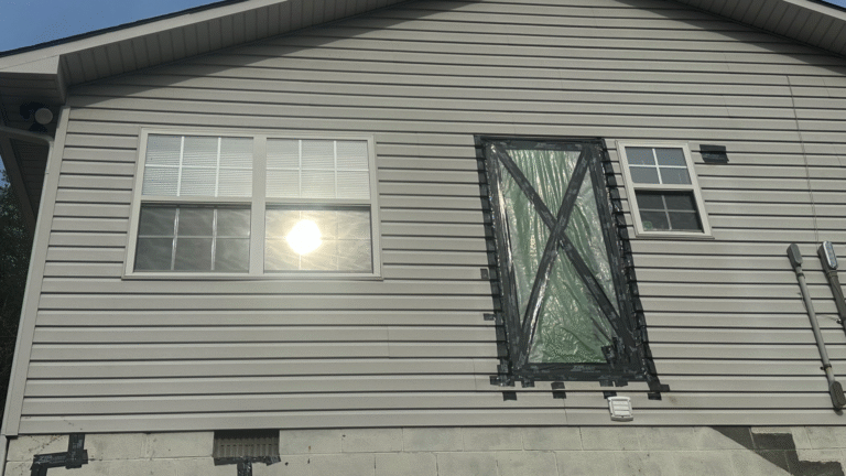 MI Homesiding expert using a zip tool to re-secure siding panels and replace fasteners.