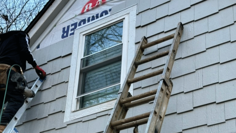 Extreme close-up showing rainwater beading on the durable, cedar-textured surface of moisture-resistant LP SmartSide siding in Knoxville.