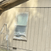 Contractor consulting with a homeowner on best siding choices for Tennessee.