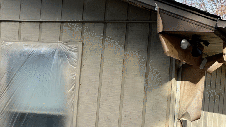 Close up of rotten wood siding that should be replaced, not painted.