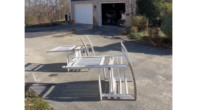 Applying vinyl-safe paint to a clean vinyl siding surface.