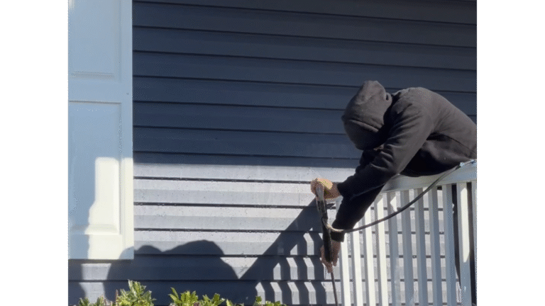 Prepping chalky aluminum siding for a fresh coat of paint.