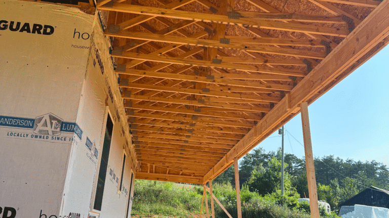 Incorrectly lapped house wrap trapping moisture against the wall.