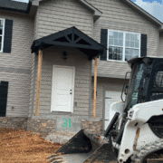 Siding installation on a 2-story new build with complex elevations.