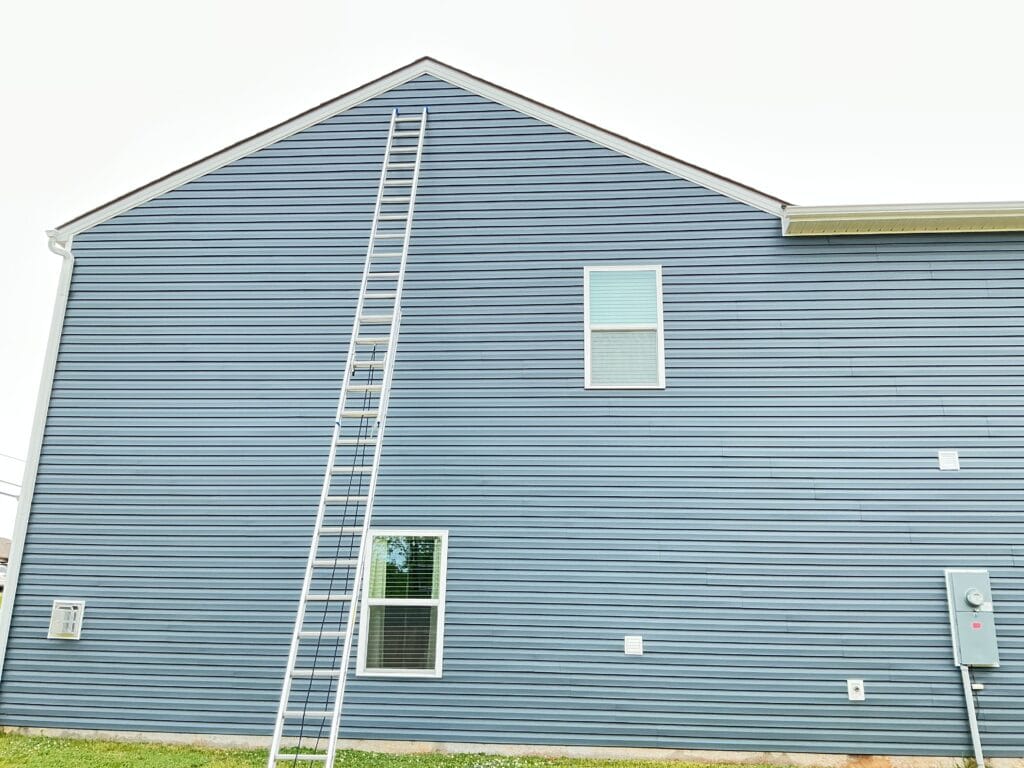 Two-story gable wall with lap siding, trim and gutters on an East Tennessee home