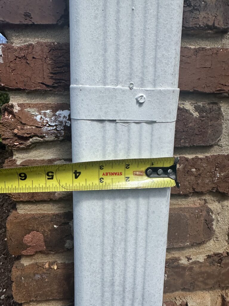 A documentary-style technical photograph captured on location, showing the reliable MI Homesiding LLC white installation box truck parked at a residential property in an East Tennessee neighborhood like Alcoa, reinforcing their expert sag repair service to Knoxville and surrounding communities.