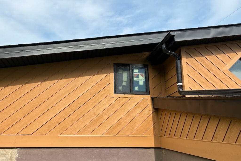 Window set into cedar board and batten siding on a Knoxville, TN home