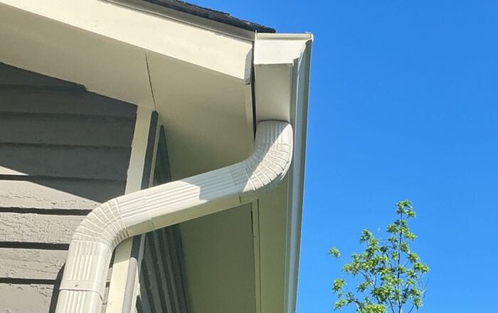 White seamless gutter and downspout installation on a Knoxville, TN home