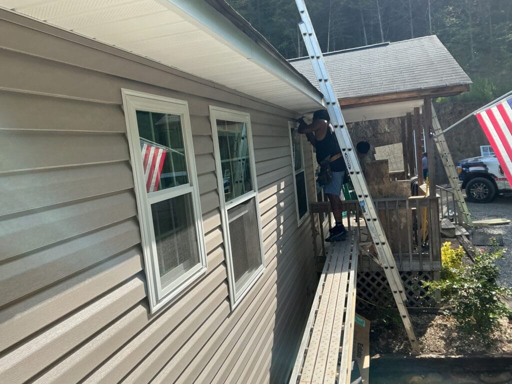 Finished beige siding and new windows on the side of a Knoxville, TN home