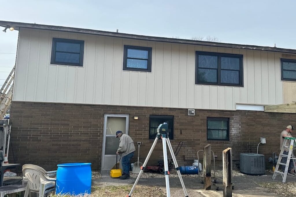 Vinyl board and batten siding installed above a brick base on a Knoxville, TN home